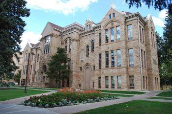 historic university building with landscaped garden