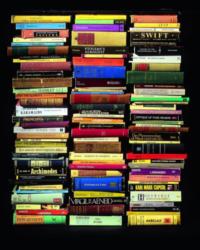 stacked books on dark background