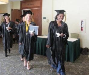 graduates walking through corridor