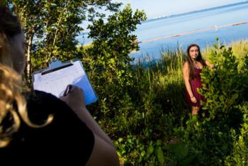 two students conducting field research outdoors