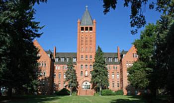 historic brick building with bell tower