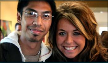 two students smiling at camera