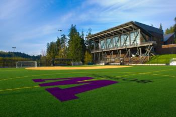 sports field with large 'w' and building