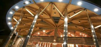 lit wooden interior of a campus building