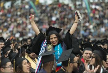 graduate cheering among crowd