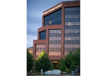 modern building facade at dusk with lights on