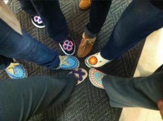 group of people's feet in a circle