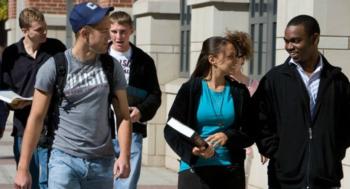 students walking and talking on campus