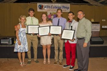 group of people holding certificates