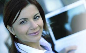 smiling woman holding a tablet