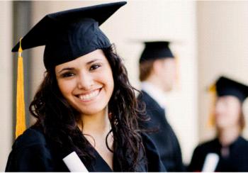 smiling graduate in cap and gown