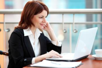 woman working on laptop in office setting