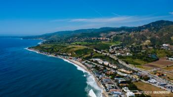 coastline with a town and hills