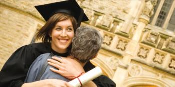 graduate hugging with diploma