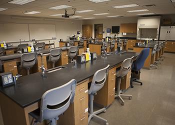 interior of a science laboratory with tables and chairs