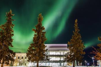 aurora borealis over university campus at night