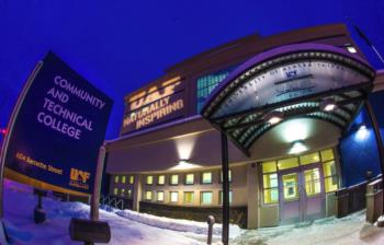 COMMUNITY AND TECHNICAL COLLEGE building entrance at night