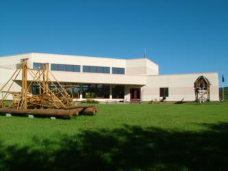 modern building with trebuchet in front