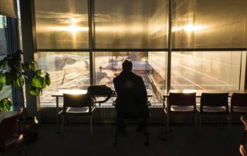 silhouette in front of sunlit window